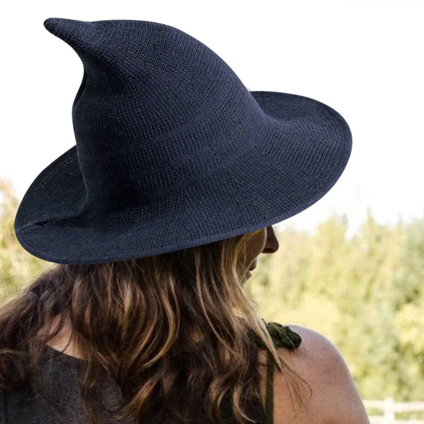 Witch Hat in outdoor setting – Witch hat being worn outdoors, emphasizing its sun-blocking capabilities and stylish design.